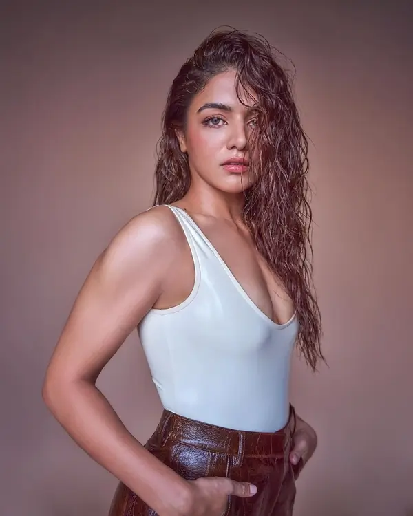 Hot Wamiqa Gabbi Shows Off Big Boobs and Cleavage in White Tank Top Paired With Leather Brown Pants (5)