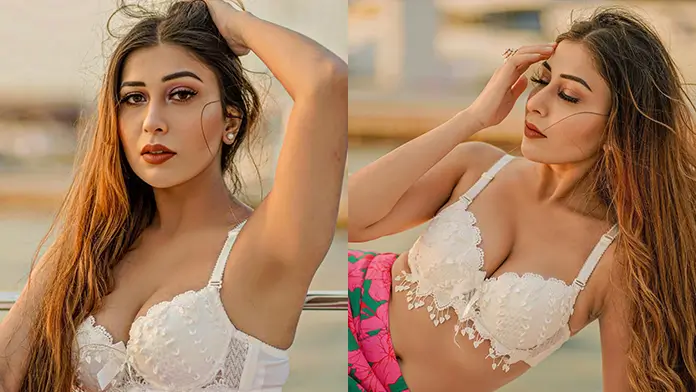 Hot Ruma Sharma Showcased Her Big Boobs and Curvy Body in White Bralette Paired With a Thigh high Slit Skirt (1)